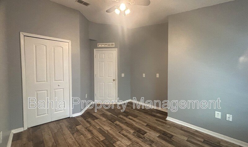 Inviting 4-bed/2-bath home in Wetherbee Lakes with no rear neighbors and a private backyard oasis! property image