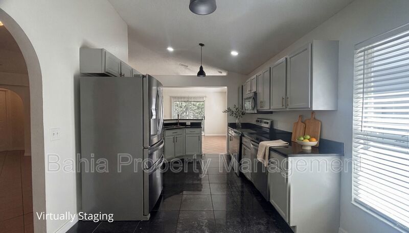 Inviting 4-bed/2-bath home in Wetherbee Lakes with no rear neighbors and a private backyard oasis! property image