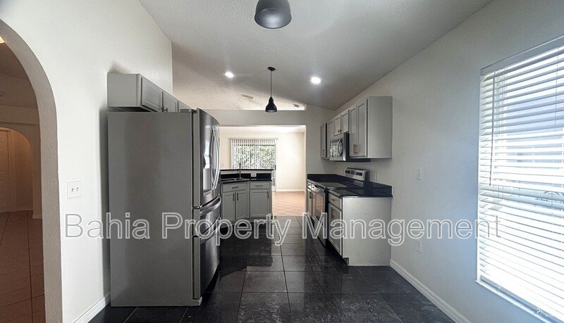 Inviting 4-bed/2-bath home in Wetherbee Lakes with no rear neighbors and a private backyard oasis! property image