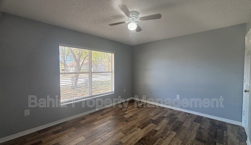 Inviting 4-bed/2-bath home in Wetherbee Lakes with no rear neighbors and a private backyard oasis! property image