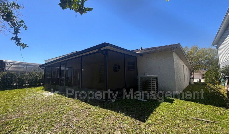 Inviting 4-bed/2-bath home in Wetherbee Lakes with no rear neighbors and a private backyard oasis! property image