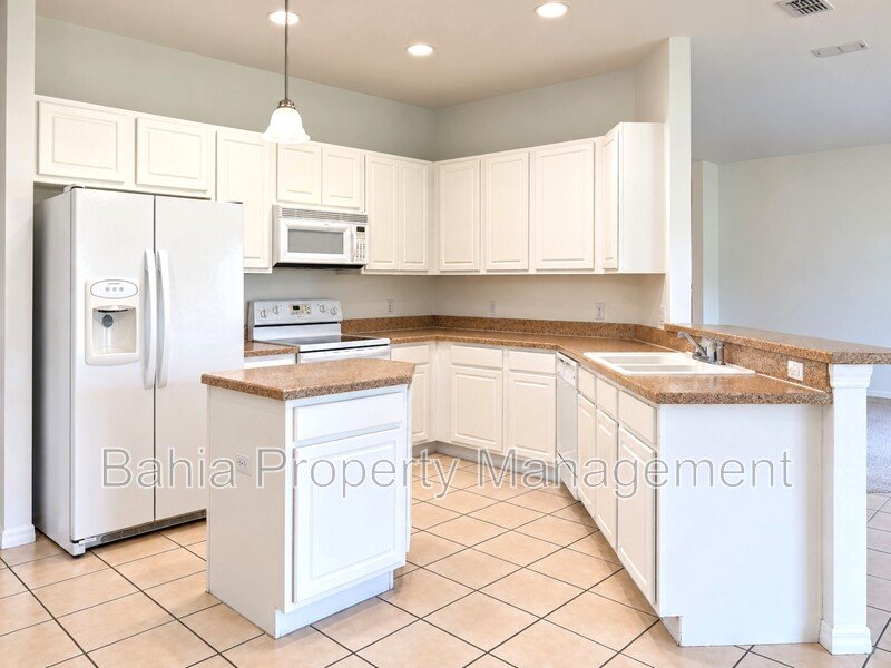 Resort-Style Living! Gorgeous 4 Bed/3 Bath Bellalago Home with 3-Car Garage. No Rear Neighbors! property image