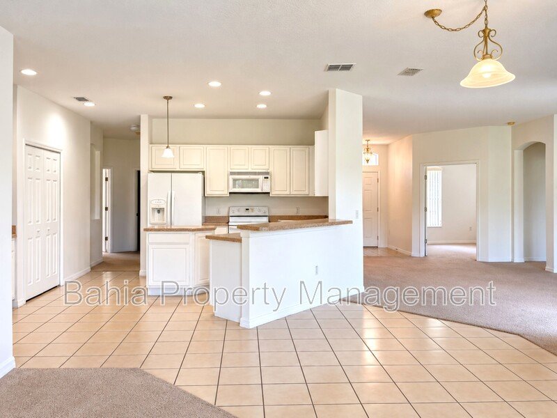 Resort-Style Living! Gorgeous 4 Bed/3 Bath Bellalago Home with 3-Car Garage. No Rear Neighbors! property image