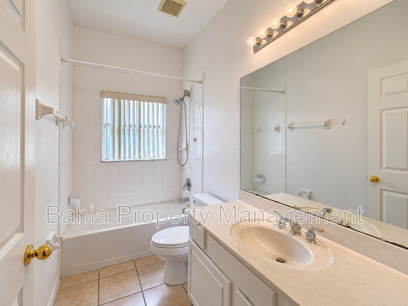 Resort-Style Living! Gorgeous 4 Bed/3 Bath Bellalago Home with 3-Car Garage. No Rear Neighbors! property image