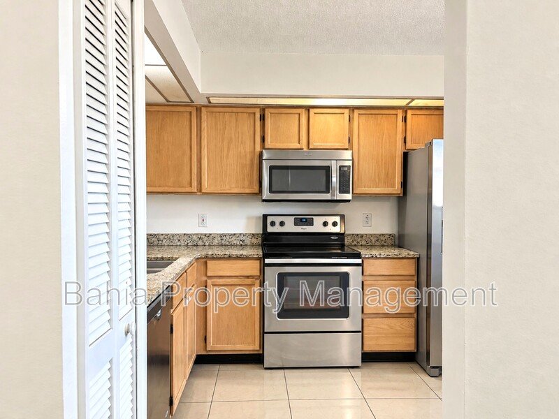 Renovated 2BD/2BA Gated Condo w/ Granite Countertops, New AC & Screened Lanai | Prime Location property image