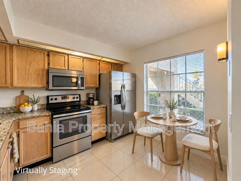 Renovated 2BD/2BA Gated Condo w/ Granite Countertops, New AC & Screened Lanai | Prime Location property image