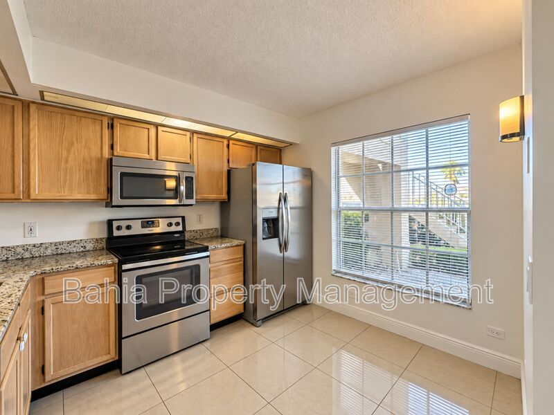 Renovated 2BD/2BA Gated Condo w/ Granite Countertops, New AC & Screened Lanai | Prime Location property image