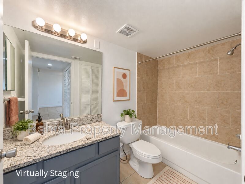 Renovated 2BD/2BA Gated Condo w/ Granite Countertops, New AC & Screened Lanai | Prime Location property image