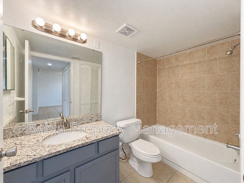 Renovated 2BD/2BA Gated Condo w/ Granite Countertops, New AC & Screened Lanai | Prime Location property image