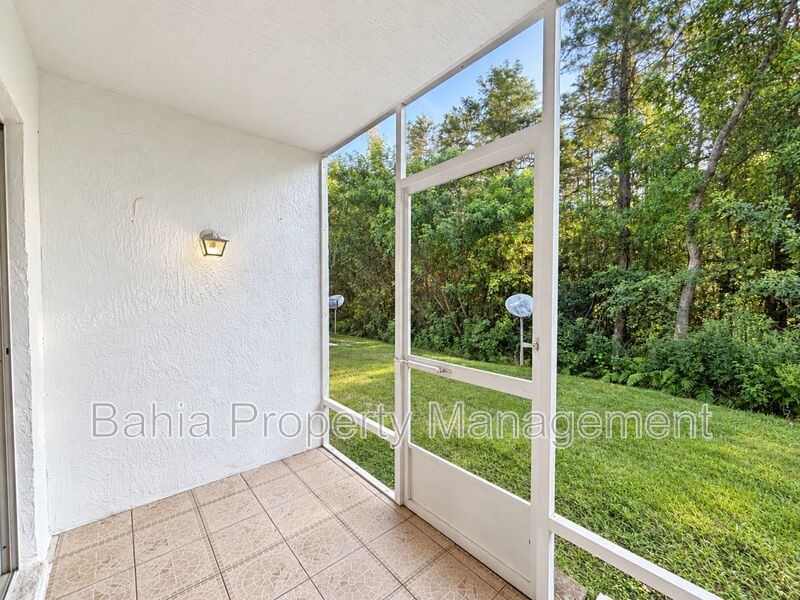 Renovated 2BD/2BA Gated Condo w/ Granite Countertops, New AC & Screened Lanai | Prime Location property image
